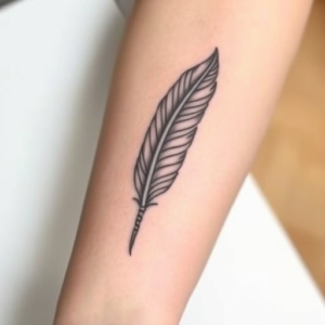 Feather with subtle shading, elegant forearm tattoo