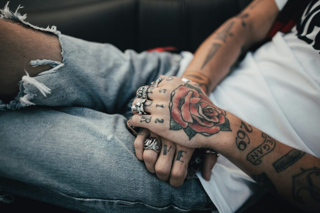 Crossed hands with tattoos. 